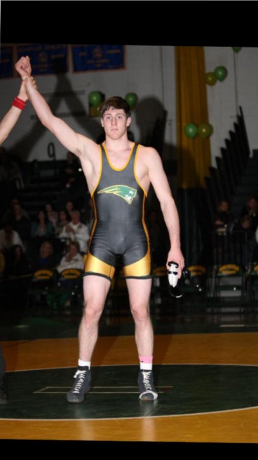 Christian Araneo celebrates winning a match at a Ward Melville dual meet