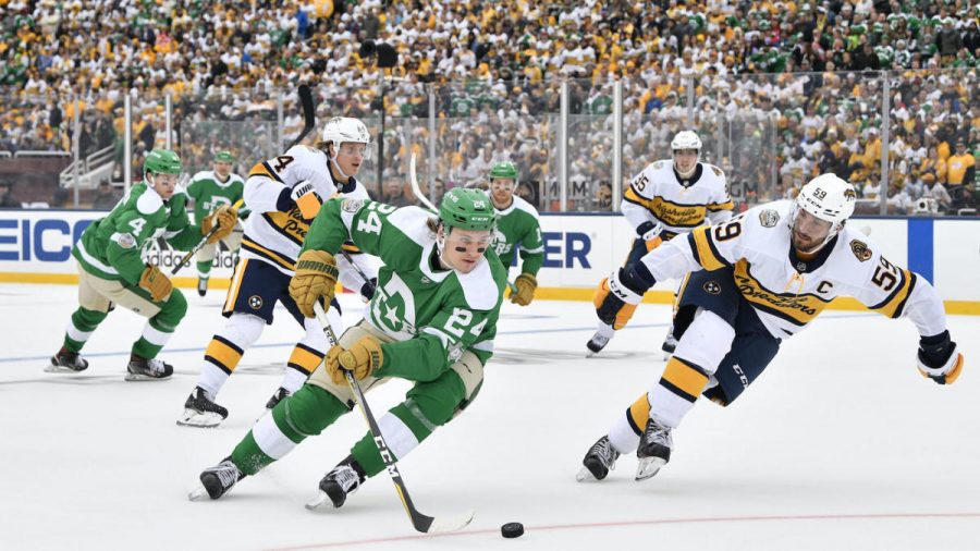 Jan 1, 2020; Dallas, TX, USA; Dallas Stars left wing Roope Hintz (24) is chased by Nashville Predators defenseman Roman Josi (59) during the third period in the 2020 Winter Classic hockey game at Cotton Bowl Stadium. Mandatory Credit: Jerome Miron-USA TODAY Sports